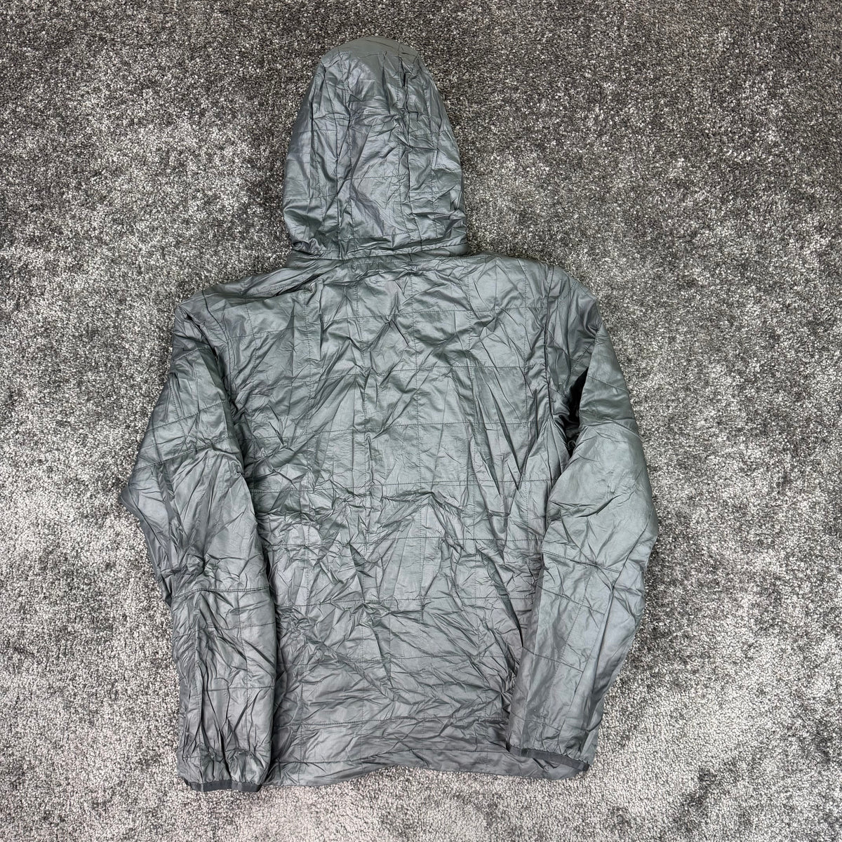 Angled front detail of pre-owned grey Nike hooded jacket