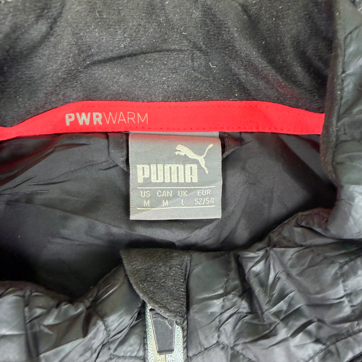Front of black Puma PWRWARM zip jacket size M