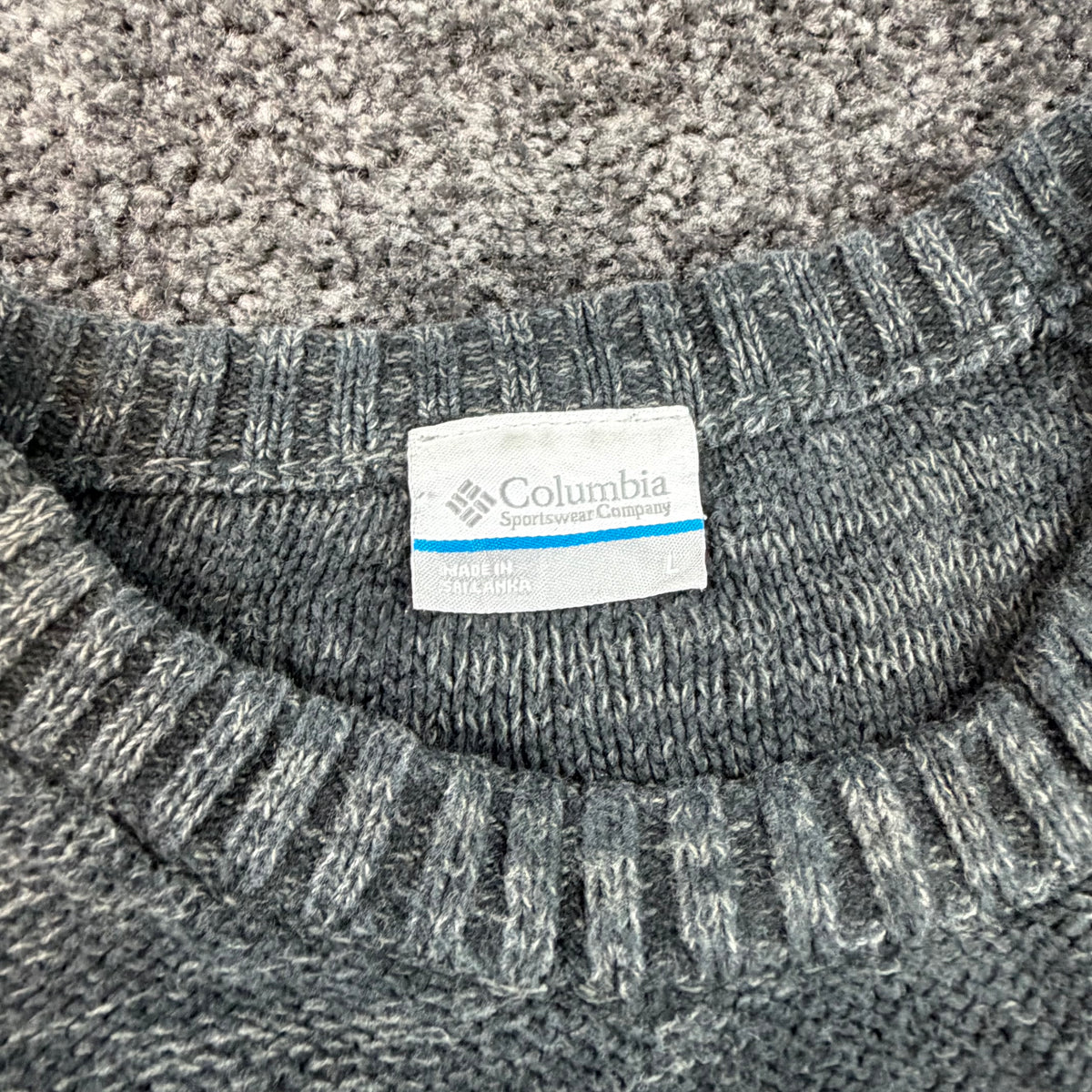 Columbia Sportswear sweater label showing size L