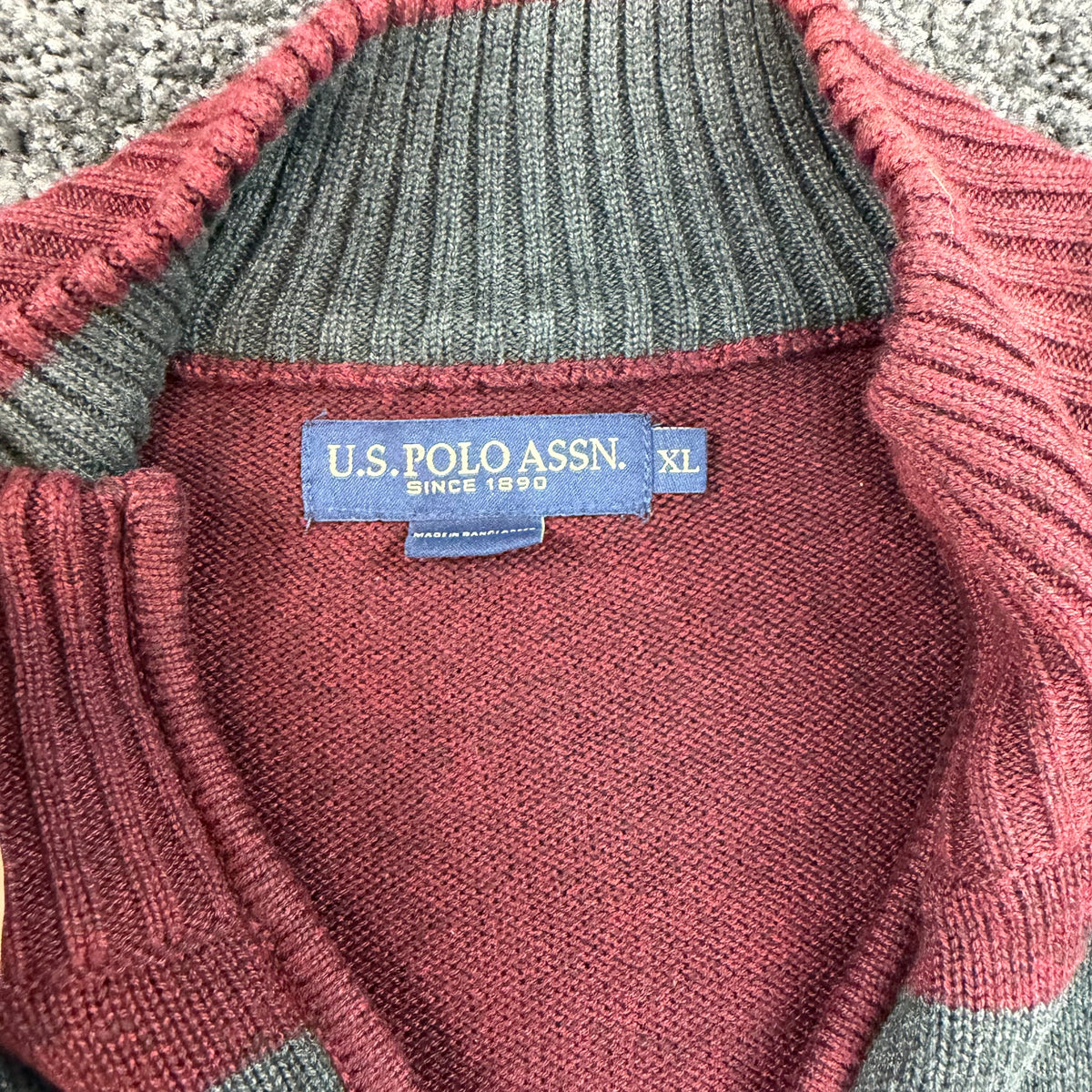 Back of burgundy U.S. Polo Assn. quarter-zip sweater